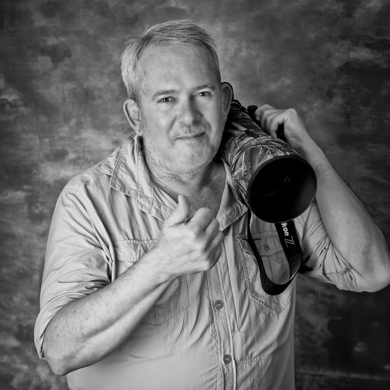 Portrait of a photographer with camera gear