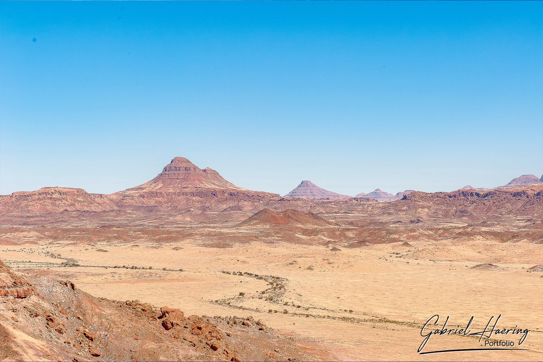 Rocky desert mountains and dry riverbed landscape in Damaraland Namibia